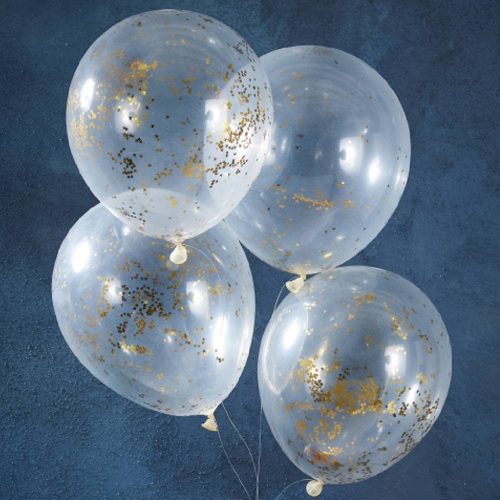 Vier transparante ballonnen gevuld met gouden stervormige confetti