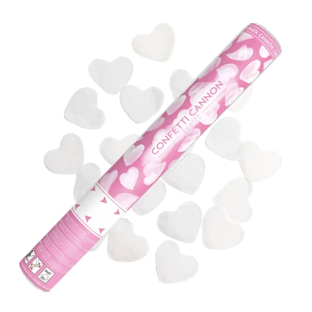 Roze party popper boven witte hartvormige confetti