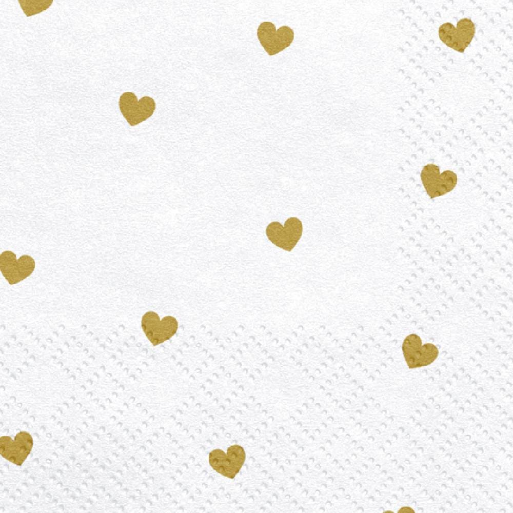 Witte servetten met gouden hartjes dichtbij