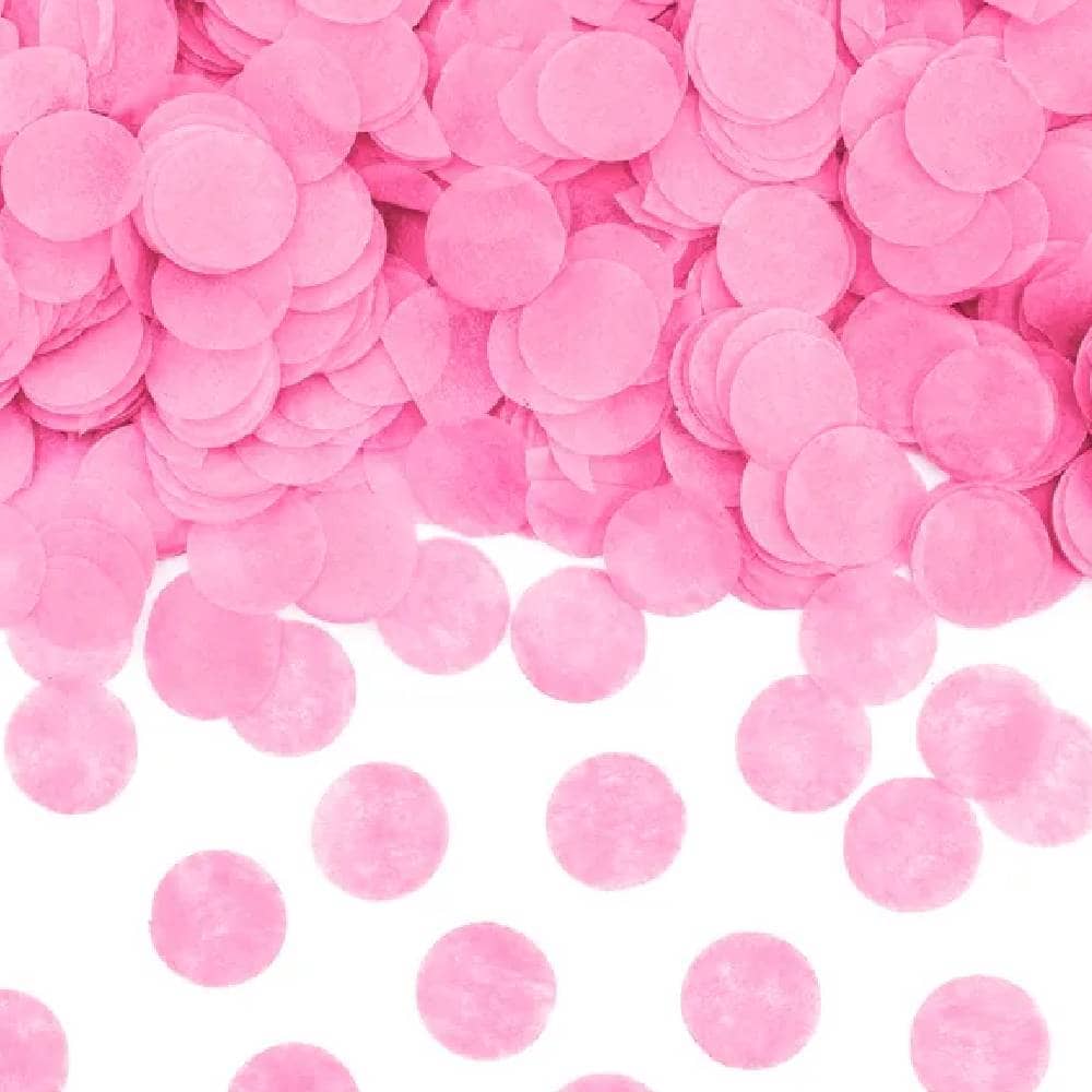 Roze confetti in de vorm van rondjes gemaakt van papier