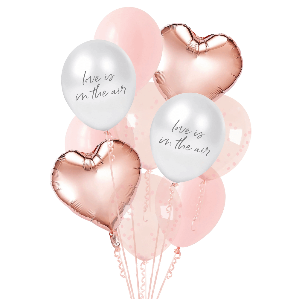 Set ballonnen bestaande uit een hartvormige folieballon, roze confettiballonnen en parelmoer ballonnen met de tekst love is in the air