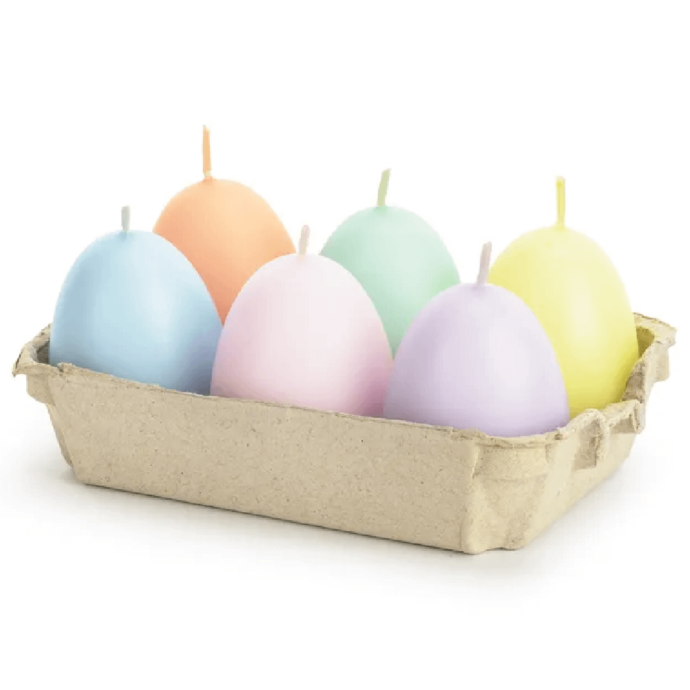 Pastelkleurige eieren in een eierdoosje
