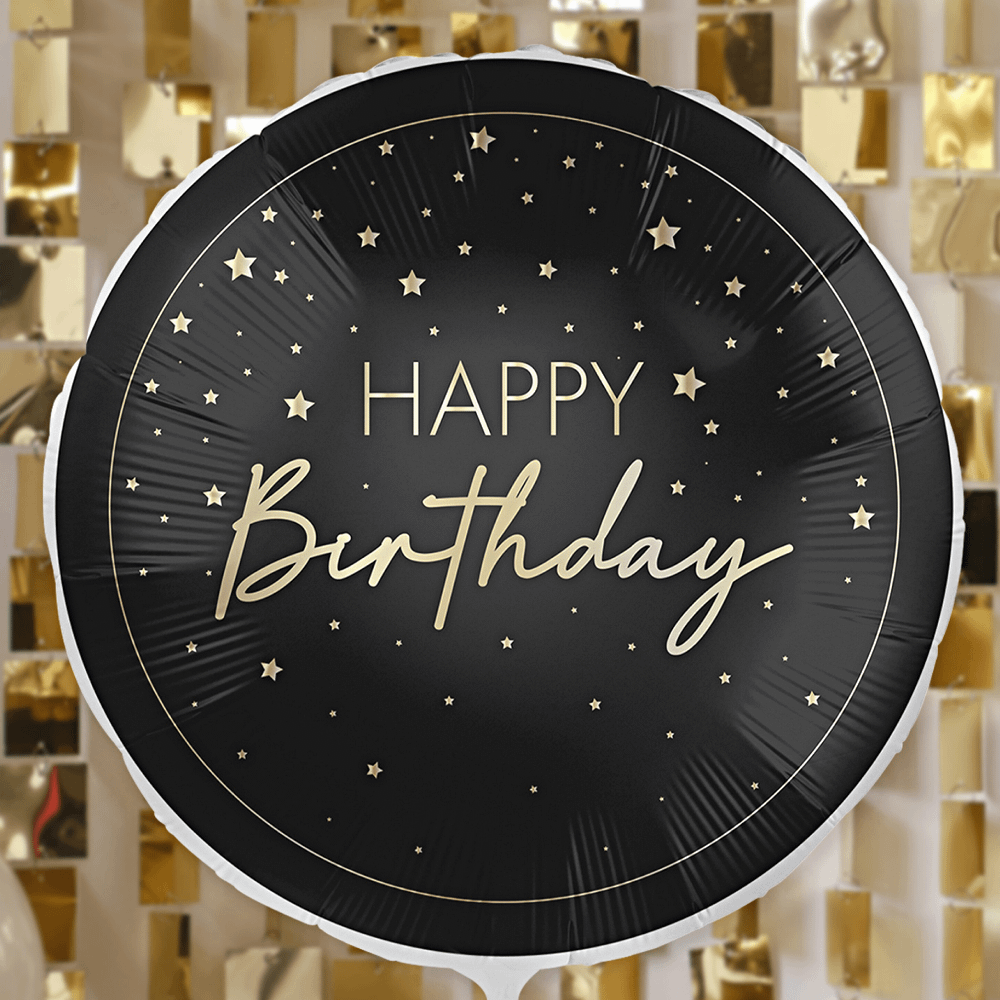 zwarte ronde ballon met gouden sterren en tekst happy birthday en gouden rand zweeft voor een gouden vierkante backdrop