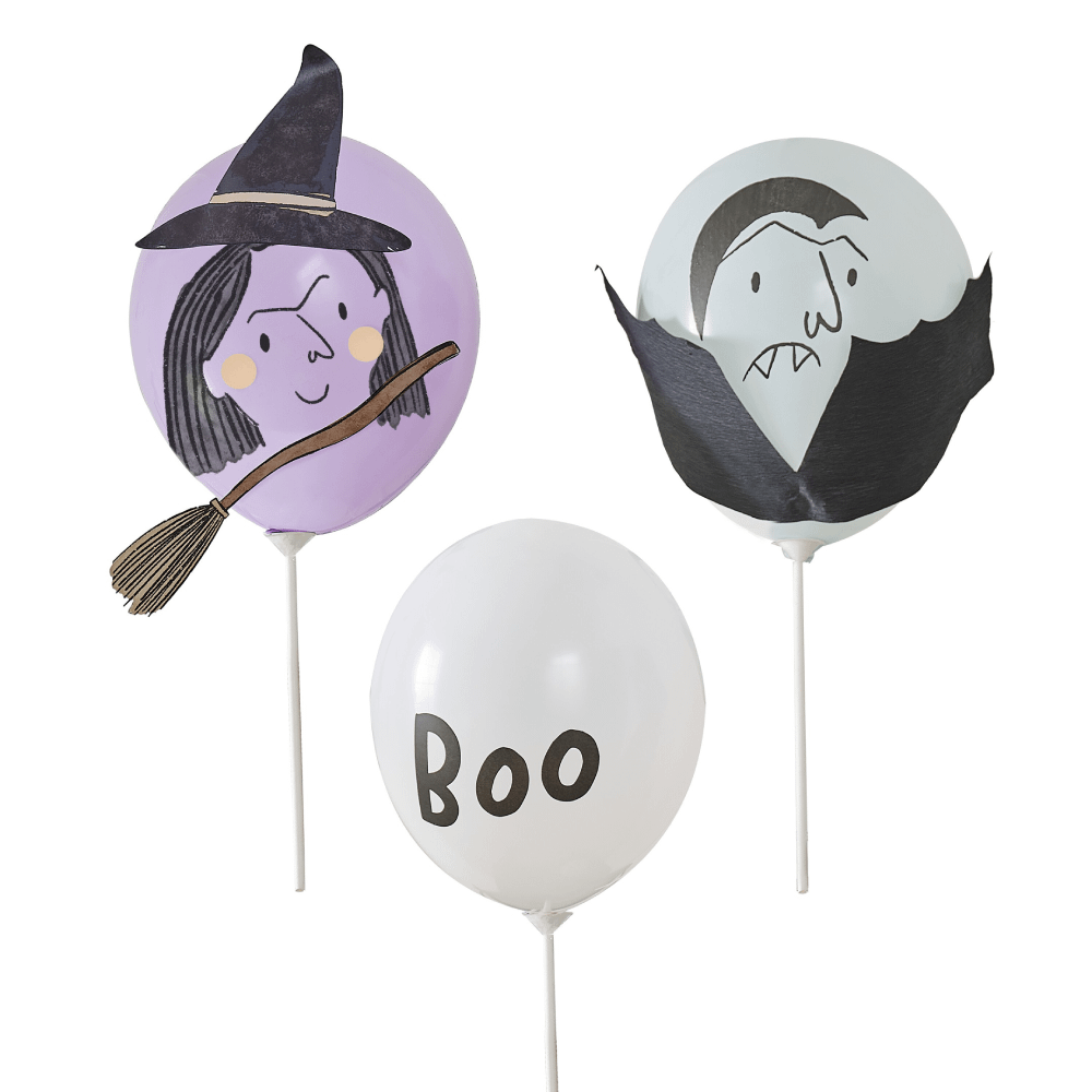 Lila, mintgroene en witte ballon bedrukt met de tekst boo, een heksengezicht en een vampier