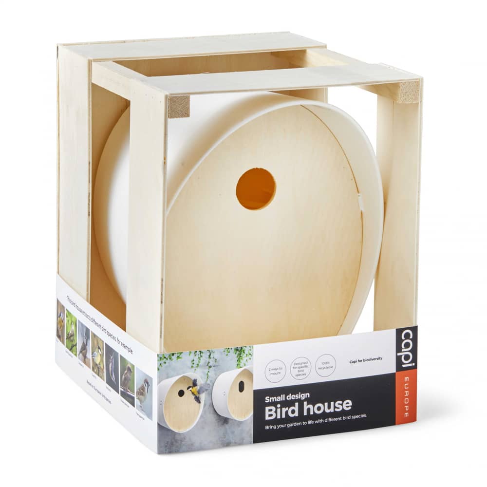 vogel huis van wit kunststof in houten kistje