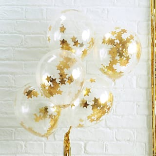 Vijf transparante ballonnen gevuld met gouden stervormige confetti