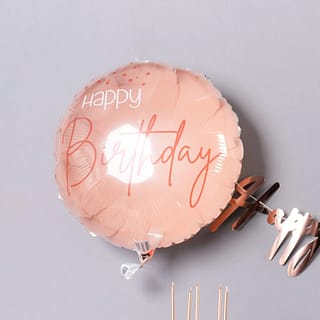 Roze ballon met happy birthday erop