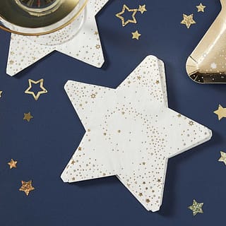 Stapel stervormige servetjes met gouden sterren erop en confetti eromheen