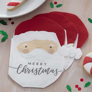 Drie servetten in de vorm van een kerstman met merry christmas erop