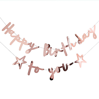rose gouden letterbanner met de tekst happy birthday to you en twee sterretjes