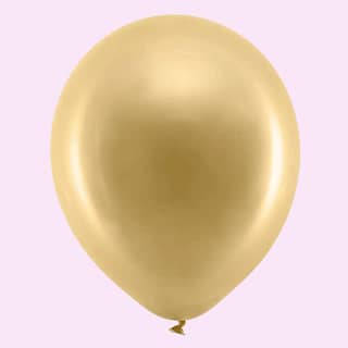Gouden ballon met lichtroze achtergrond